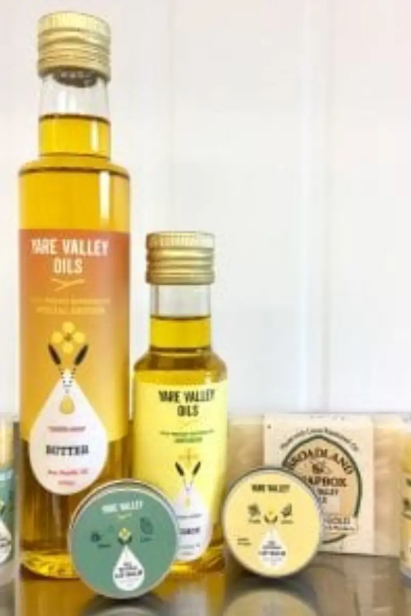 Yare Valley Oils gift products including rapeseed oil bottles, lip balms and soap displayed together.