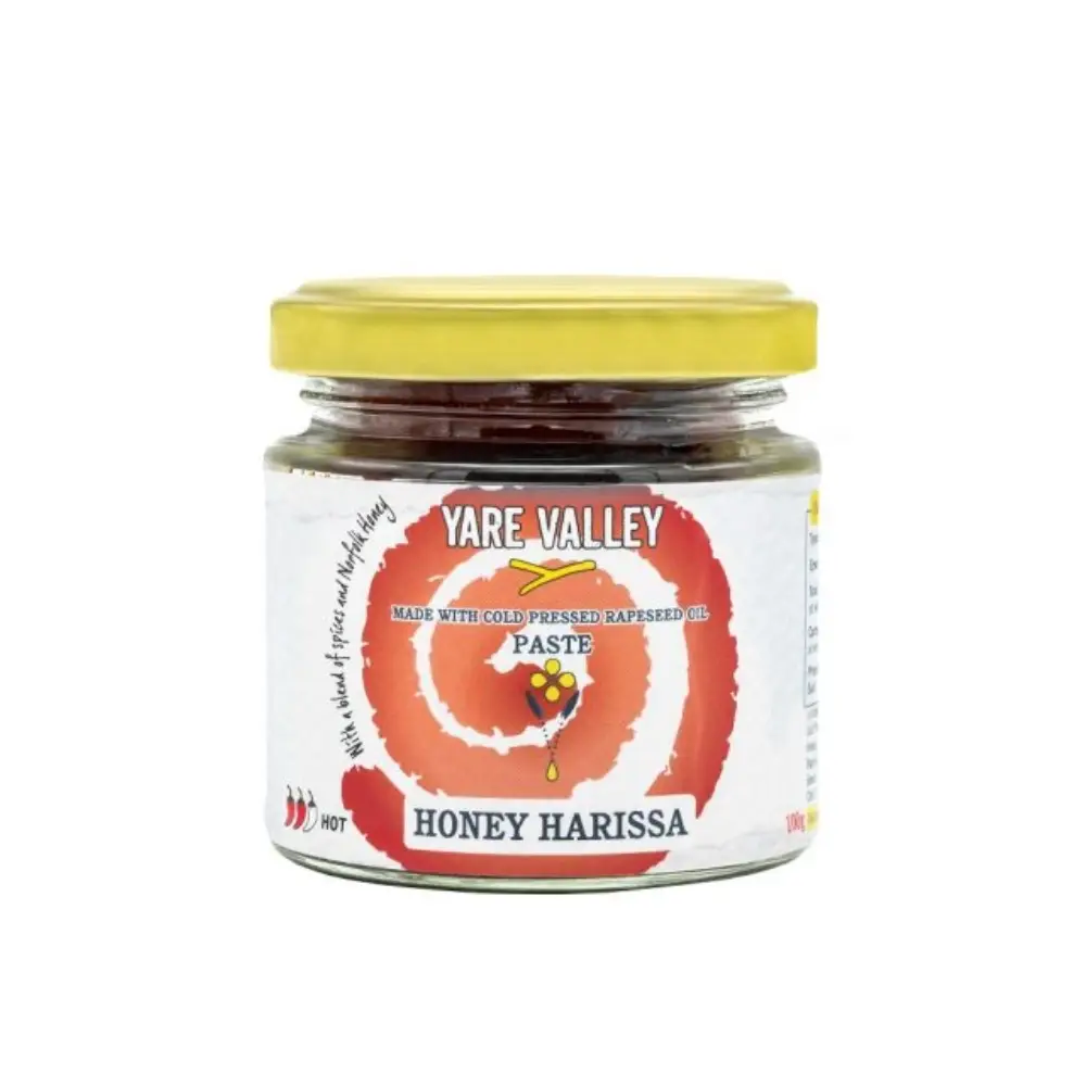 Jar of Yare Valley Honey Harissa paste made with cold pressed rapeseed oil on a white background.
