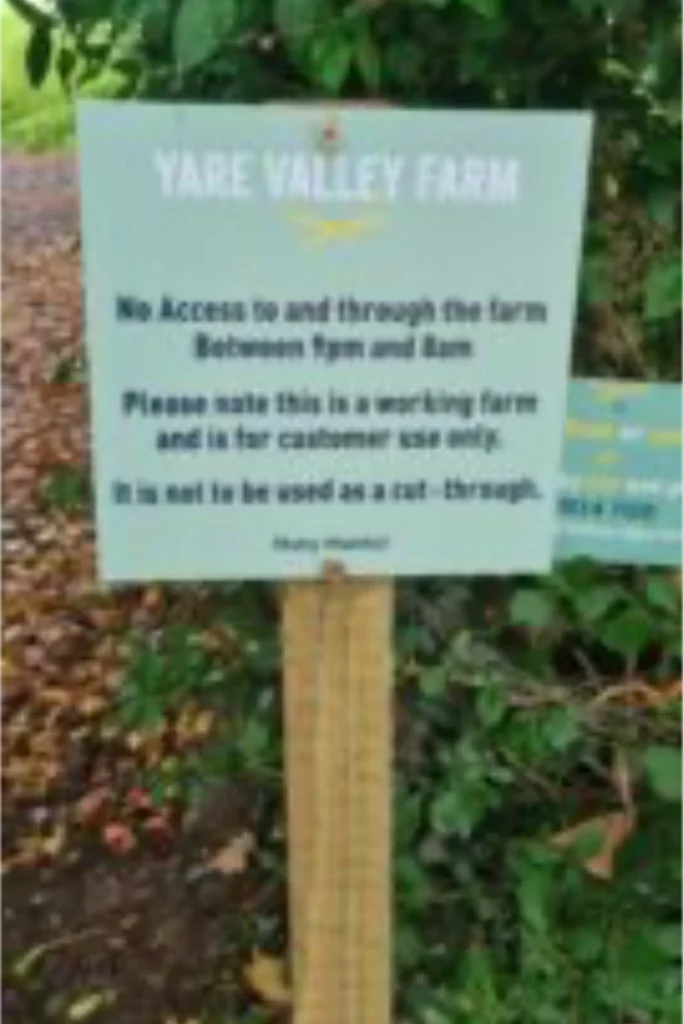 Yare Valley Farm sign asking visitors not to access the working farm between track and lane.